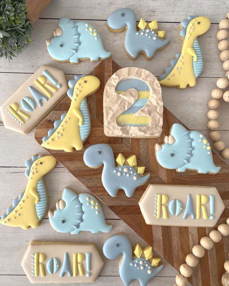 Whimsical Dinosaur-Themed Cookies in Colorful Pastel Display for Kid's Birthday Party.