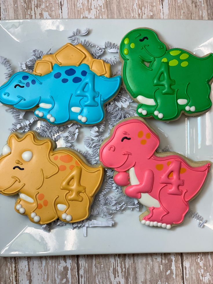 Vibrant Dinosaur-Shaped Cookies: Whimsical Treats for Themed Parties.