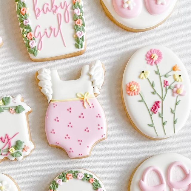 Whimsical Floral and Baby-Themed Cookie Designs in Soft Pastel Colors