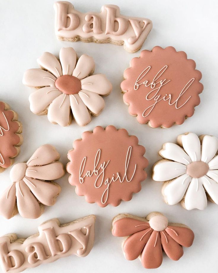 Elegant Pastel Cookie Designs with Floral Shapes for Celebrations.