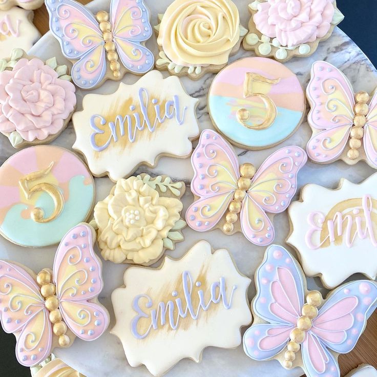 Whimsical Pastel Decorative Cookies Enhance Celebrations with Butterflies and Flowers.