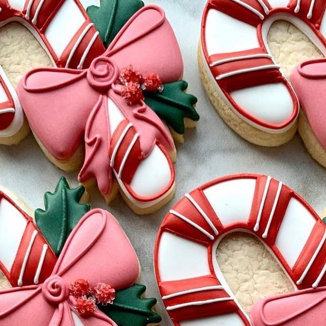 Festive Decorative Cookies with Candy Cane Designs and Cheerful Color Combinations.