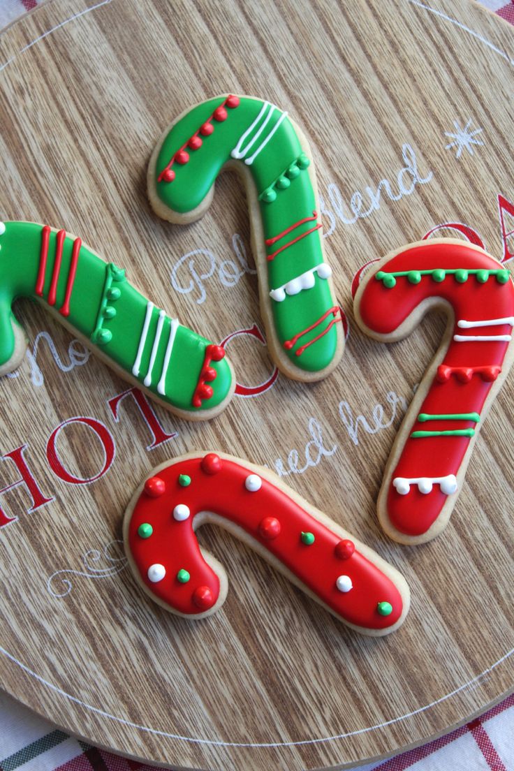 Festive Candy Cane Cookies: Cheerful Holiday Treats with Vibrant Icing and Playful Designs.