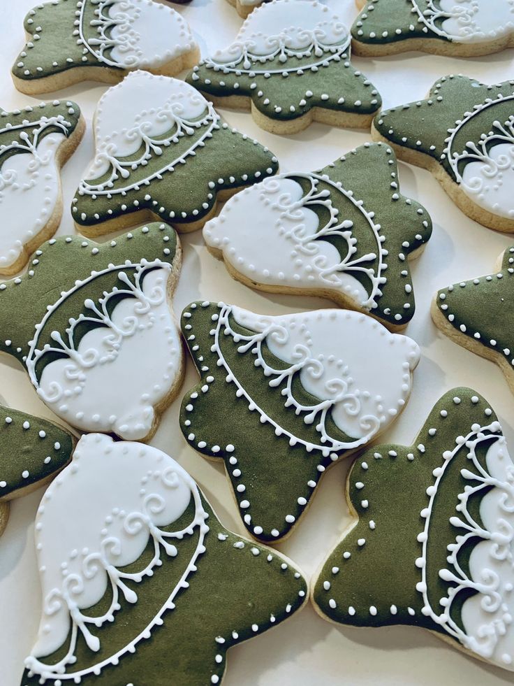 Festive Holiday-Inspired Cookies Showcasing Elegant Designs and Contrasting Icing.