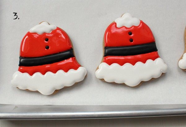 Festive Santa Hat Cookies: A Cheerful Holiday Treat with Vibrant Icing and Intricate Details.