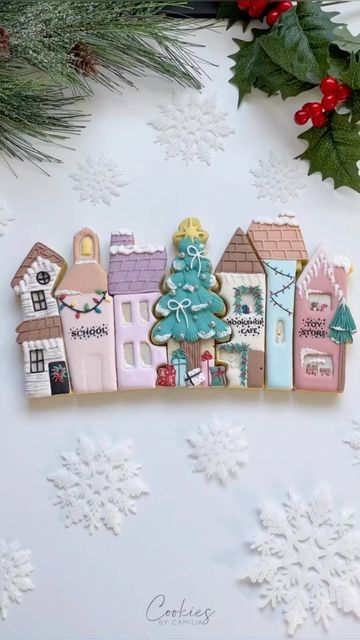 Charming Whimsical Cookie Design Showcasing Colorful Festive Houses and Christmas Trees.