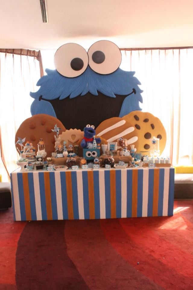 Playful Colorful Dessert Display Featuring Whimsical Cookie Monster and Themed Treats