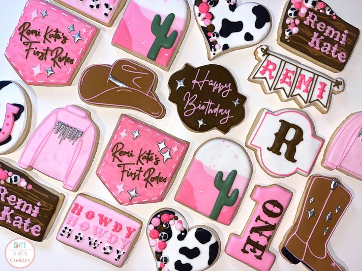 Western-themed decorative cookies with cowboy hats and boots in vibrant pink and black for festive celebrations.