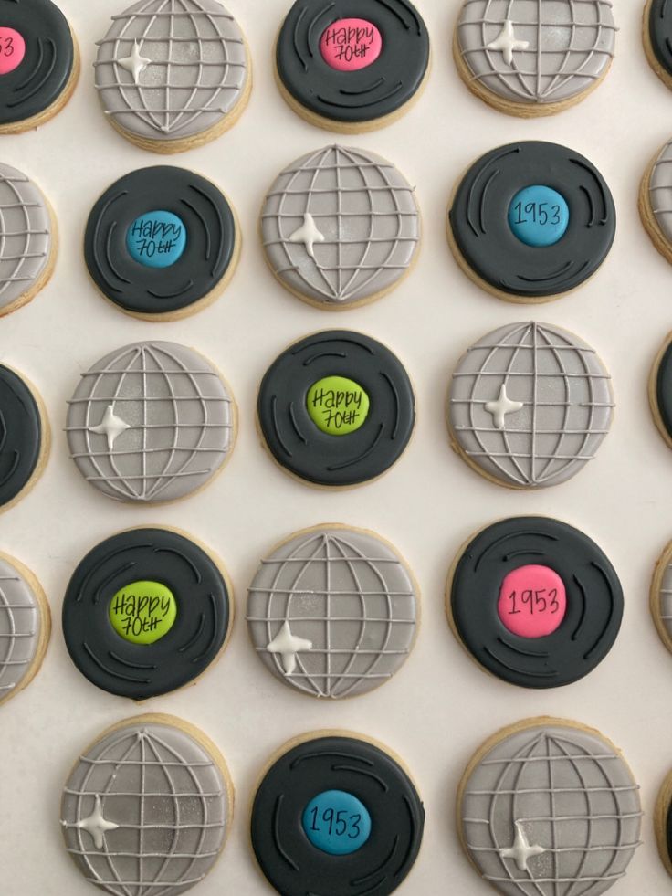 Modern Decorated Cookies with Intricate Globe-Inspired Designs in Grey, Black, and Vibrant Accents for Celebratory Milestones.