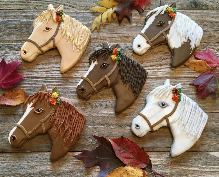 Artfully Designed Colorful Horse-Shaped Cookies Decorated with Charming Autumn Accents.