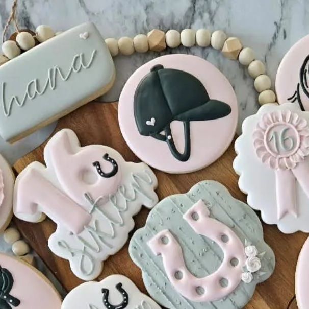 Thematic Decorative Cookies in Playful Pastel Colors for Celebrations.