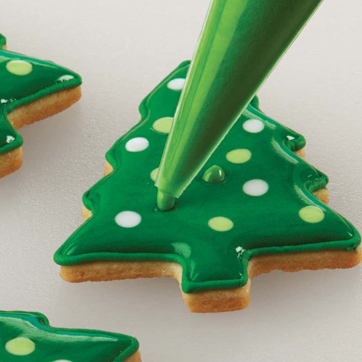 Whimsical Festive Cookies with Vibrant Green Icing and Playful Polka Dots