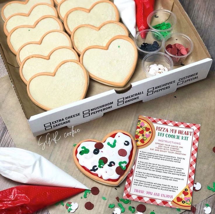 Colorful DIY Heart-Shaped Cookie Kit with Toppings for Creative Pizza-Themed Baking.