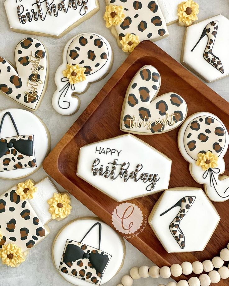 Elegant Leopard Print Cookies with Playful Designs for Festive Celebrations