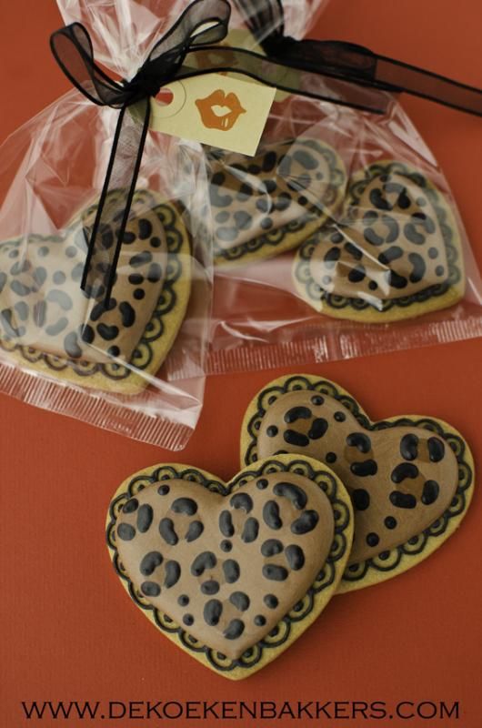 Chic Leopard Print Heart-Shaped Cookies: Trendy Treats Inspiring Bold Nail Designs.