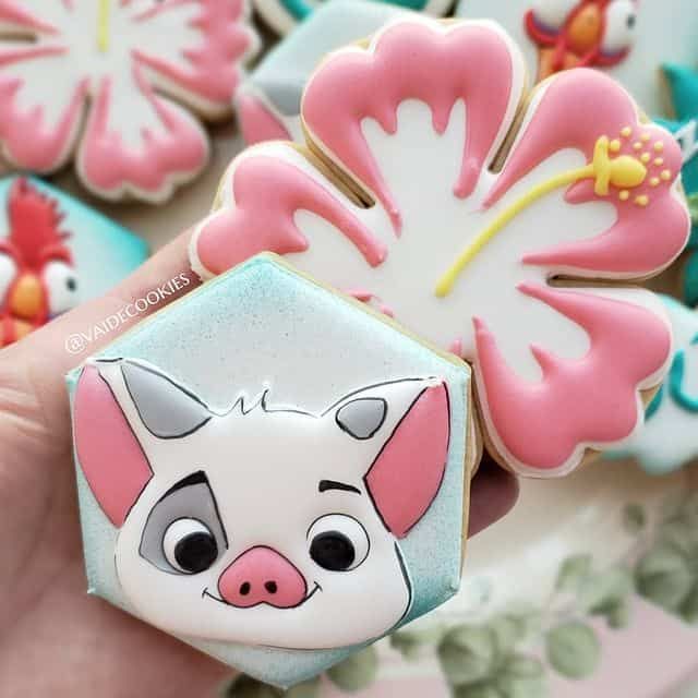 Whimsical Tropical Cookie Designs with Playful Pig and Vibrant Hibiscus Flowers