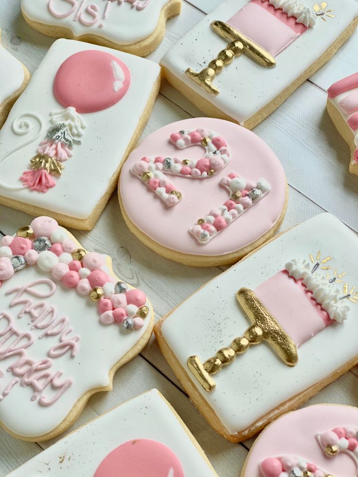 Vibrant Pink and Gold Decorative Cookies: Whimsical Birthday Treats with Intricate Icing.