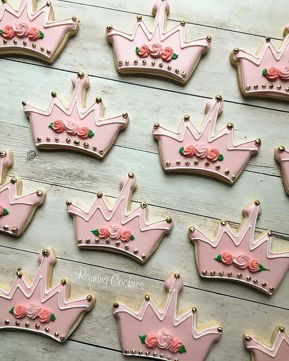 Regal Crown Cookies with Pink Icing and Floral Accents for Whimsical Celebrations.