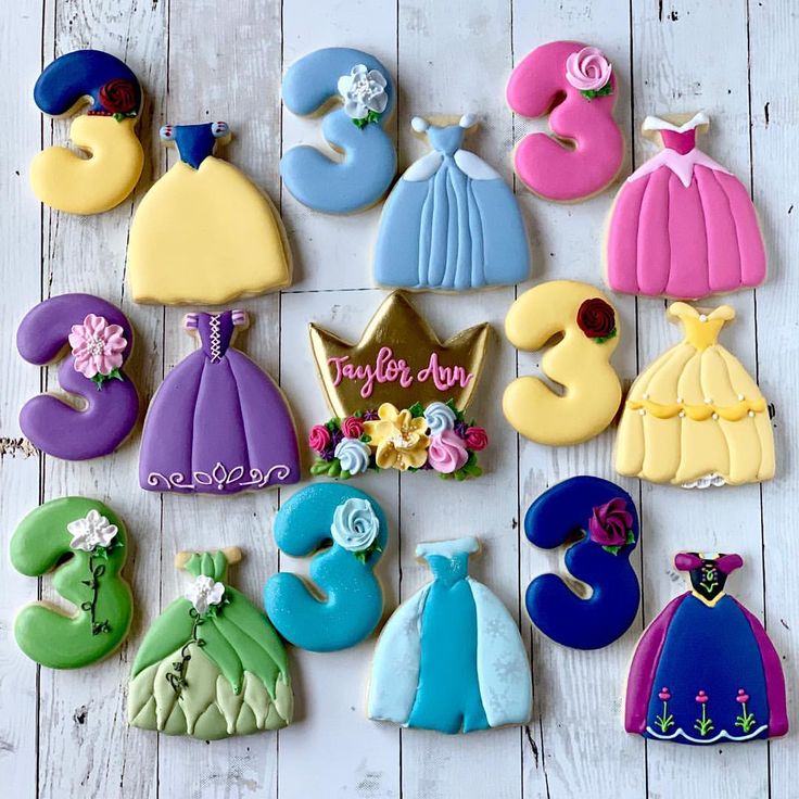 Whimsical Dress and Number-Shaped Cookies Enhance Festive Celebrations with Colorful Floral Designs.