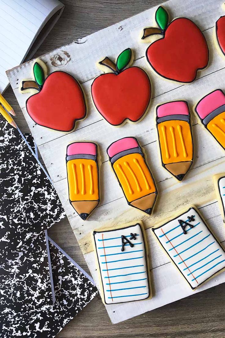 Cheerful Back-to-School Themed Cookie Designs: Apples, Pencils, and Notebooks.