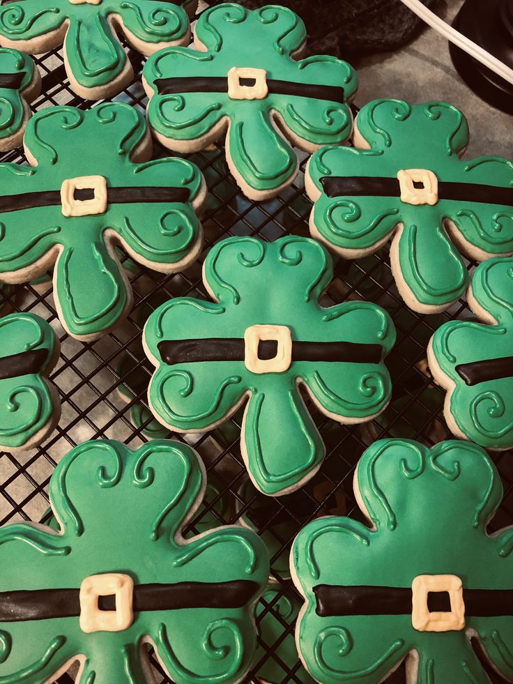 Vibrant Frosted Shamrock Cookies with Festive Designs for St. Patrick's Day Celebrations.