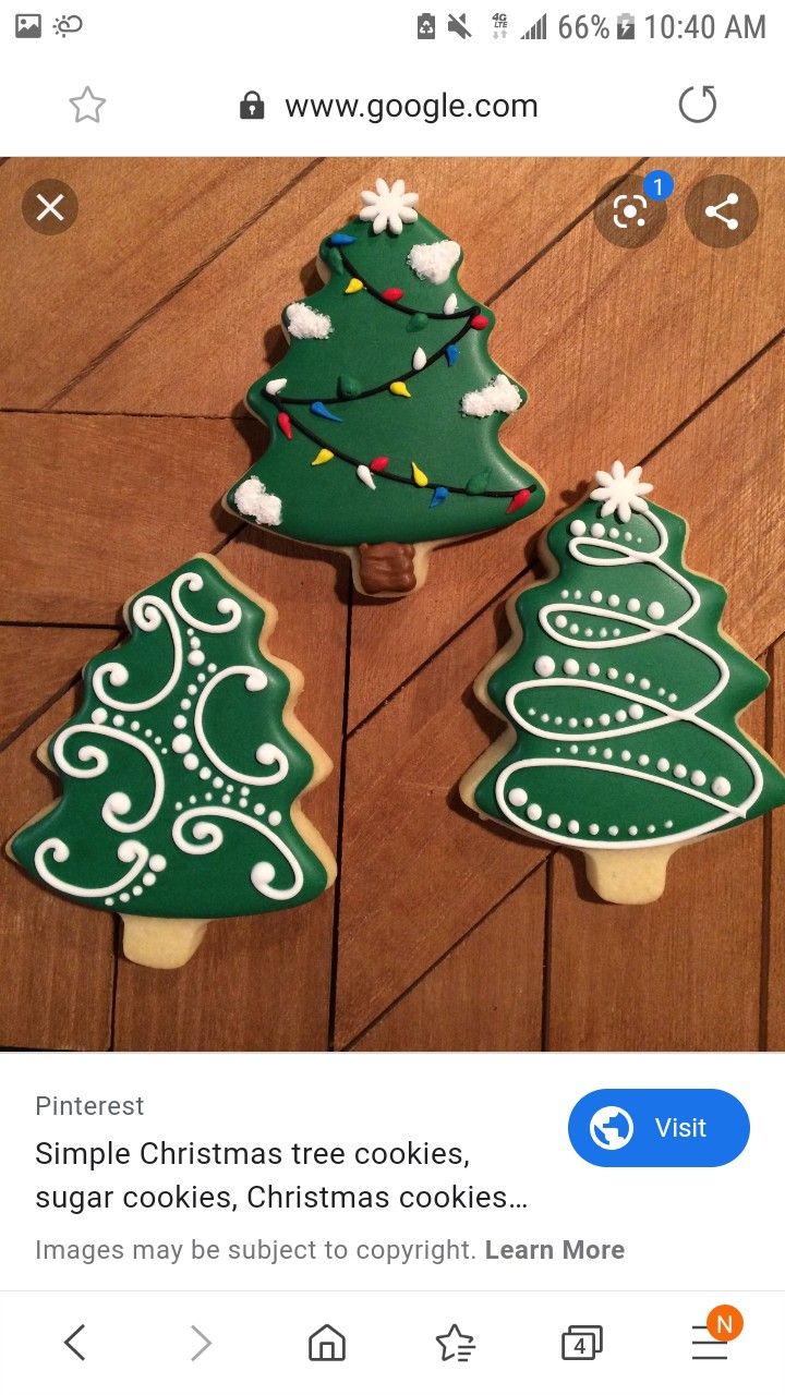 Elegant Festive Christmas Tree Cookies with Vibrant Icing and Unique Designs.