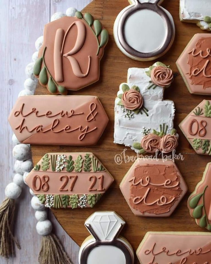 Elegant Decorative Cookies on Wooden Platter for Festive Celebrations.